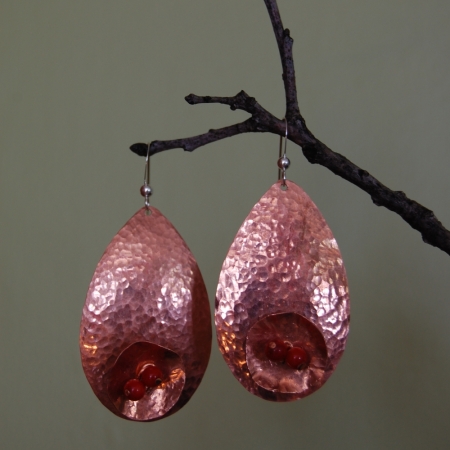 Hammered copper earrings with flowers and red stones